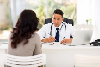 medical doctor consulting patient in office