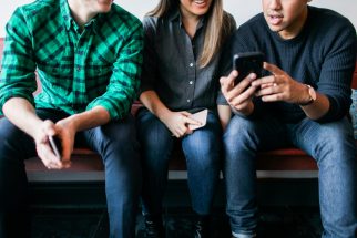 Three Millennials on Mobile Phones